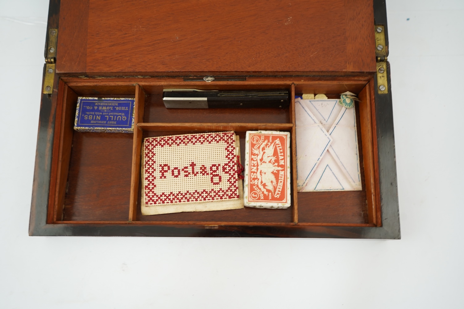 A mid 19th century rosewood writing and sewing box